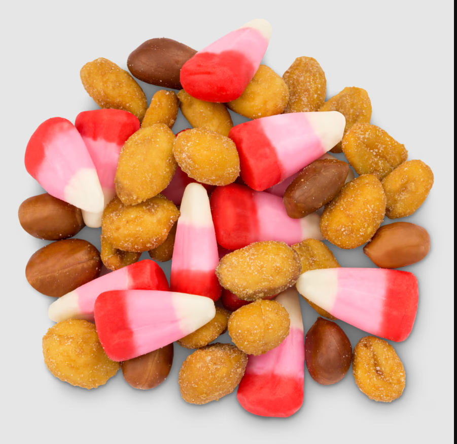 Cupid's Love Potion by Minonk Chocolate Company features pink, red, and white candy corn mixed with honey roasted peanuts and chocolate-covered peanuts. Available in an 8 oz. pack shown on a light gray background.